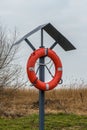 Lifebuoy stand in a small harbor Royalty Free Stock Photo