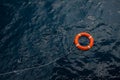 Lifebuoy in a stormy blue sea, Lifebuoy in blue sea, safety equipment in offshore or marine Royalty Free Stock Photo