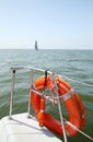 Lifebuoy on a yacht side. Concept of safe sea walk.