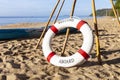 Lifebuoys for tourists are prepared on the beach in front of the resort