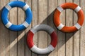 Lifebuoys on Wooden Wall with Sand