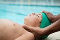 Lifeguard assisting unconscious boy Royalty Free Stock Photo