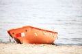 Lifeguard beach rescue equipment orange boat Royalty Free Stock Photo