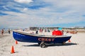 A lifeguard boat on the sands