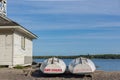 Lifeguard boat stored at beach by shack end of day Royalty Free Stock Photo