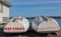 Lifeguard boat stored at beach by shack end of day Royalty Free Stock Photo