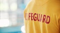 Lifeguard, closeup and swimming pool safety at indoor facility for training, swim and exercise. Pool, attendant and