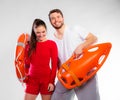 Lifeguard couple with rescue equipment Royalty Free Stock Photo