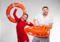 Lifeguard couple with rescue equipment Royalty Free Stock Photo