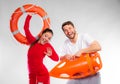 Lifeguard couple with rescue equipment