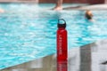 lifeguard equipment next to bright blue pool