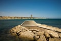 A lifeguard flag at small pedestal viewpoint at Secret Paradise of Aluminos beach, Larnaca, Cyprus