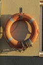 Lifeguard hanging on the wall in the port of Santa Pola, Spain Royalty Free Stock Photo