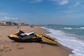 Lifeguard jetski next to the sea ready for a rescue Royalty Free Stock Photo