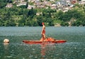 Lifeguard on a orange rowing boat - Caldonazzo lake italy
