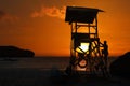 Lifeguard ready to take care of tourists on the beaches. Asian Lifeguard standing on the tower at sunrise