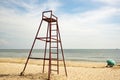 Lifeguard sead on the sand with woman on the beach Royalty Free Stock Photo