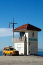 Lifeguard shack and yellow pick up truck Royalty Free Stock Photo