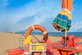 Lifeguard tools, umbrella,lifebuoy and rescue boat. Royalty Free Stock Photo