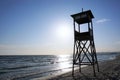 Lifeguard tower on beach at daytime with blue sky and wavy sea background. Royalty Free Stock Photo
