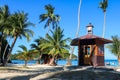 Lifeguard tower on the coconut beach. The clock tower, Hut or Cottage against the blue sky Royalty Free Stock Photo