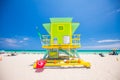 Lifeguard tower in a colorful Art Deco style, with blue sky and Atlantic Ocean in the background. World famous travel location. So