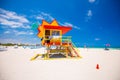 Lifeguard tower in a colorful Art Deco style, with blue sky and Atlantic Ocean in the background. World famous travel location. So