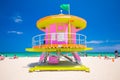 Lifeguard tower in a colorful Art Deco style, with blue sky and Atlantic Ocean in the background. World famous travel location. So