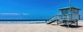 Lifeguard Tower on empty sandy Venice beach Los Angeles California USA. Sky, sea, copy space. Banner Royalty Free Stock Photo