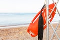 Lifeguard tower with orange buoy on the beach. rescue buoy on the iron rescue post Royalty Free Stock Photo