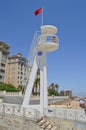 Lifeguard Tower With A Red Flag On The Beach