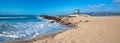 Lifeguard tower and rock jetty seawall in Ventura California U