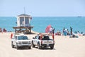 Lifeguard Trucks Parked by an Observation Tower