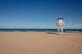 Lifeguard watch tower on empty beach Royalty Free Stock Photo