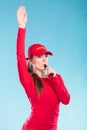 Lifeguard woman in cap on duty blowing whistle. Royalty Free Stock Photo