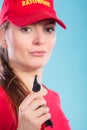 Lifeguard woman in cap on duty with whistle.