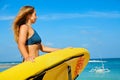 Lifeguard woman stand with surf rescue board on beach Royalty Free Stock Photo