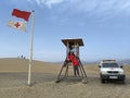 Lifeguards on a beach during windy weather