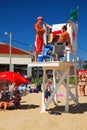 Lifeguards hold a conversation on a sunny day