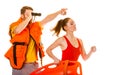 Lifeguards in life vest with rescue buoy running Royalty Free Stock Photo