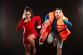 Lifeguards in life vest with ring buoy whistling. Royalty Free Stock Photo