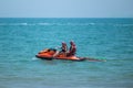 2 lifeguards on a red personal watercraft patrol sea along the beach Royalty Free Stock Photo