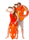 Lifeguards with rescue ring buoy and life vest. Royalty Free Stock Photo