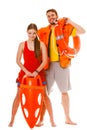Lifeguards with rescue ring buoy and life vest.
