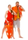 Lifeguards with rescue ring buoy and life vest. Royalty Free Stock Photo