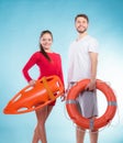 Lifeguards with rescue and ring buoy lifebuoy. Royalty Free Stock Photo