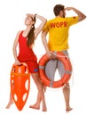 Lifeguards with rescue and ring buoy lifebuoy. Royalty Free Stock Photo