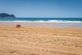 Lifeguards seats on the beach near the ocean Royalty Free Stock Photo