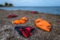 Lifejackets left by refugees on the shore of Lesvos Royalty Free Stock Photo