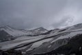 Lifeless rocky snow-covered mountains, view from the slope of Elbrus, North Caucasus, Russia Royalty Free Stock Photo